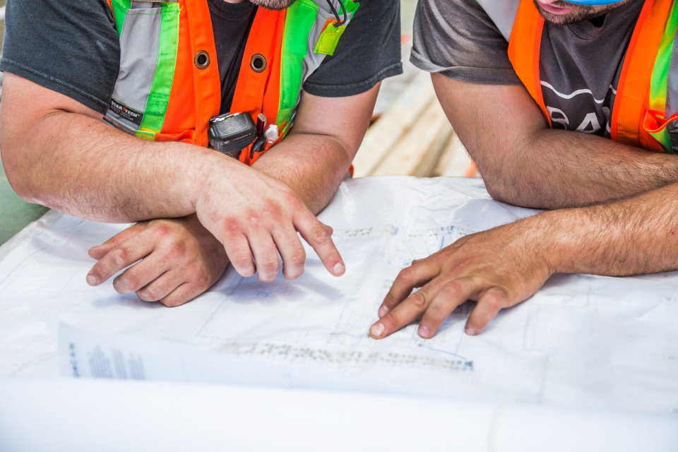 Architectural plans being reviewed for construction project coordination